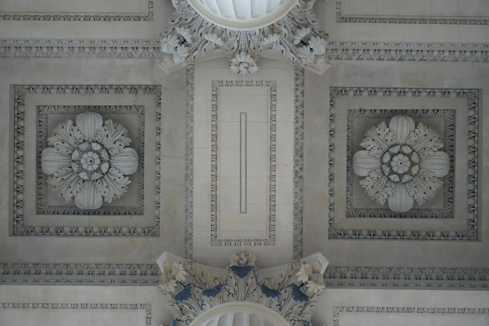 A decorative plaster ceiling with raised patterns