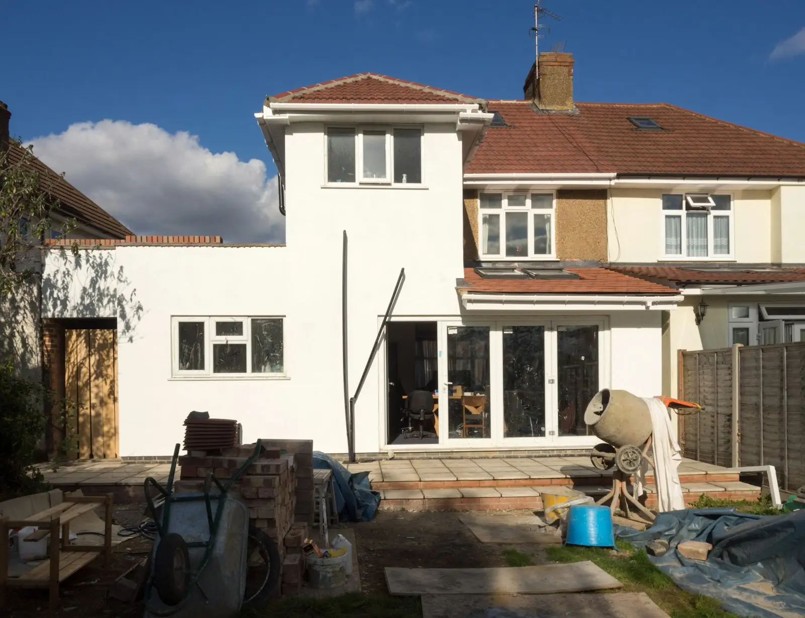 A house extension with freshly finished white render